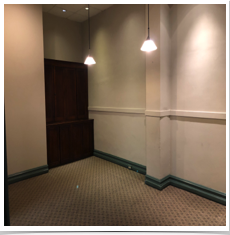 Conference room with built-in original cabinets.